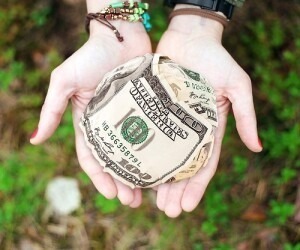 ball of money in hands