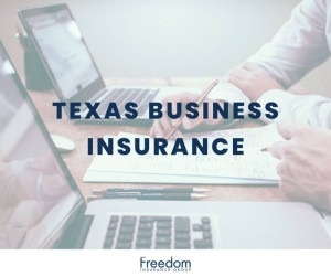 Paperwork and laptops inside of an office.