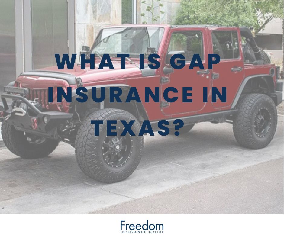 Red jeep sitting in a driveway.